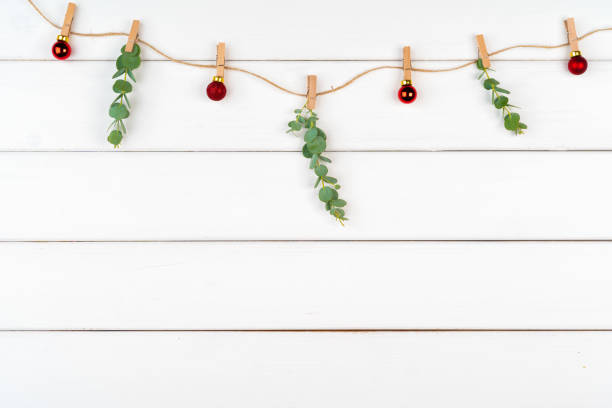istock Christmas decorations on white wooden background with copy space 1345298202