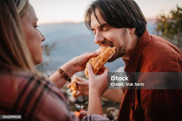 Sharing A Sandwich Stock Photo - Download Image Now - Sandwich, Sharing, Eating