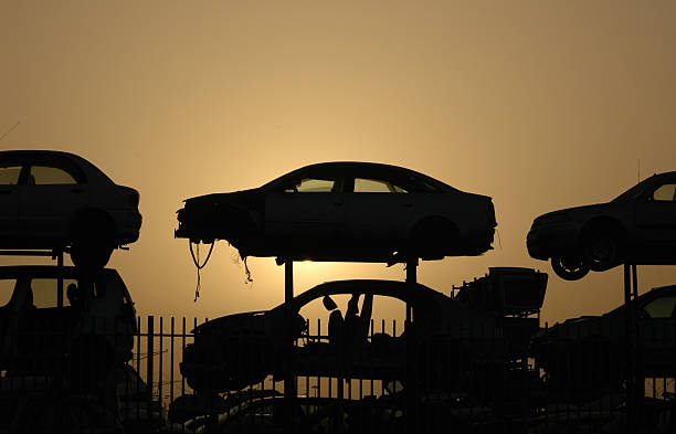 Cars Cemetery Cars cemetery at sunset pileup stock pictures, royalty-free photos & images