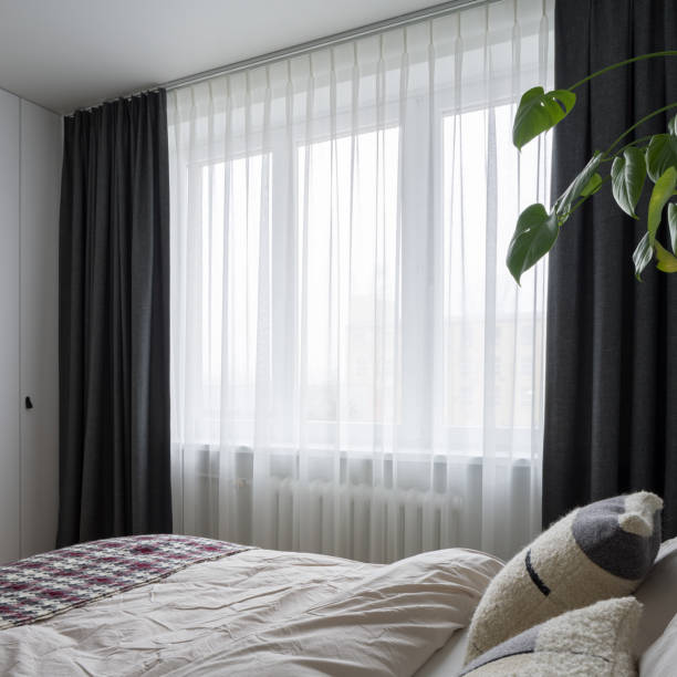 istock Bright bedroom with big window 1345299441