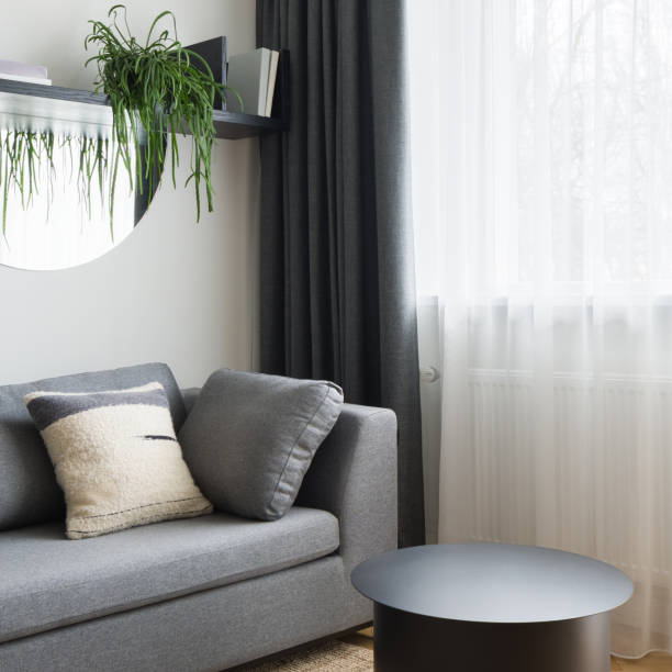 small living room with window behind curtains - side table imagens e fotografias de stock