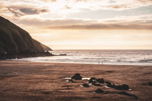 istock View out to sea from a beach at sunset 1345301699