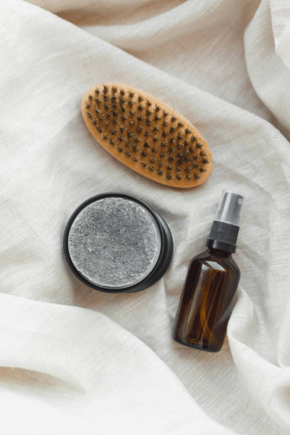 istock beard grooming kit with natural solid shampoo, beard brush and aroma oil on linen textile, top view, flat lay 1345303009
