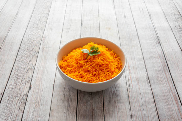 Indian Fried Rice with garnish on grey wooden table stock photo