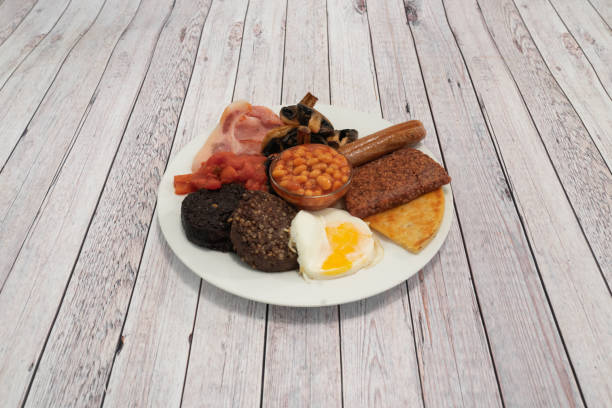 Full English Breakfast on grey wooden table stock photo