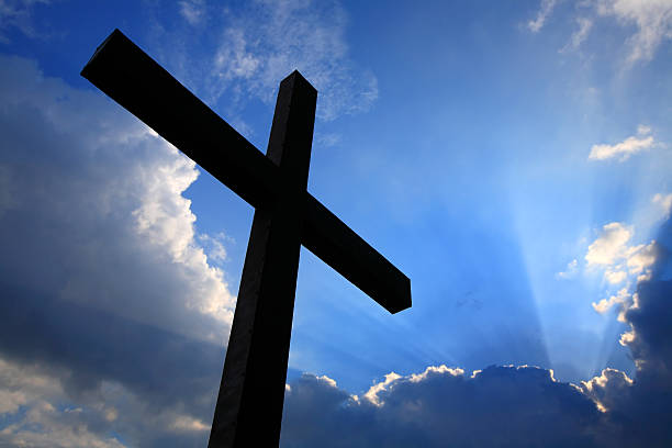 istock Cross silhouette and the clouds 134530845