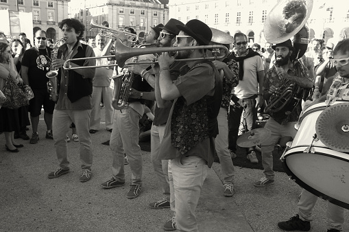 Lisbon, Portugal - July 20, 2014: A band of street musicians performs at the Praça do Comércio square in Lisbon downtown.