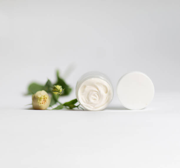 istock Cream in a jar on a white background 1345312350
