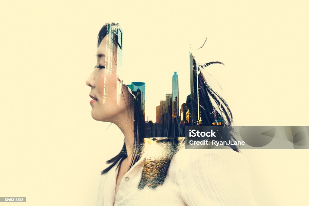 Woman City Reflections Digital Composite A profile of a Korean business woman's face, a Chicago cityscape superimposed over her portrait; double exposure.  Conceptual image of people and their relationship with the city. Multiple Exposure Stock Photo