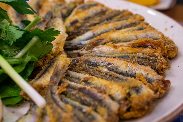 Fried Anchovies (Turkish Name: Hamsi Tava) Collage from different photos of delicious seafood. taste test stock pictures, royalty-free photos & images