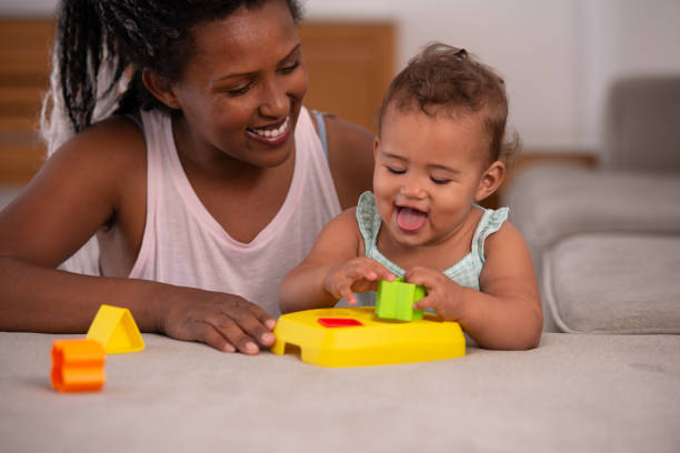 istock Mother and baby playing game. 1345319524