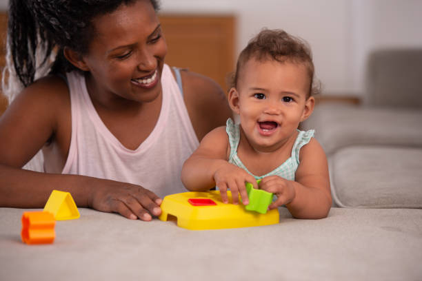 istock Mother and baby playing game. 1345319532