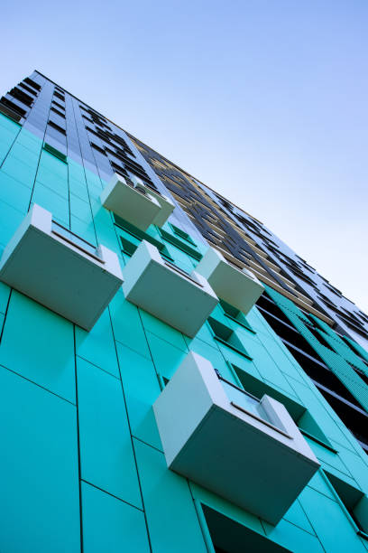 istock bottom view of a multi-storey modern blue building . urban jungle 1345323403