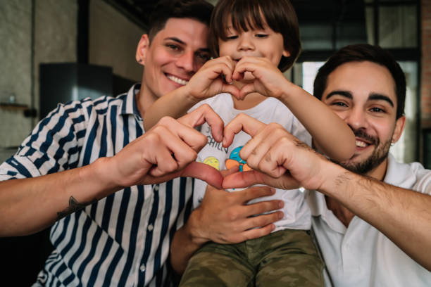 istock Happy gay couple with their son. 1345324564