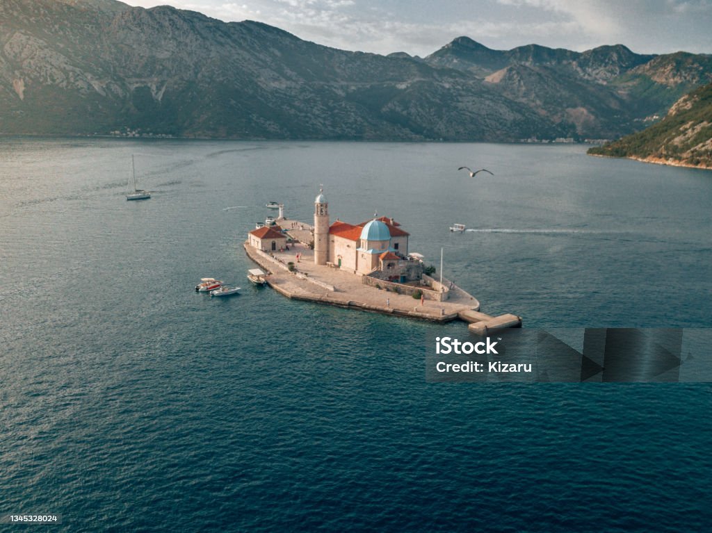 Our lady of the rocks or "Gospa od Skrpjela" as locals call this beautiful islet in Boka Kotorska bay Bay of Water Stock Photo