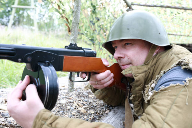 istock Soldier shooting PPSh-41 submachine gun 1345329437