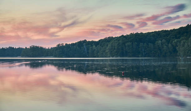 istock Lake at a peaceful sunset. 1345329833