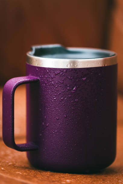 istock Purple color isothermal mug in the rain 1345336165