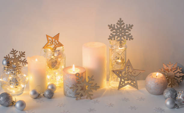 istock Christmas decoration with candles on background  white wall 1345336666