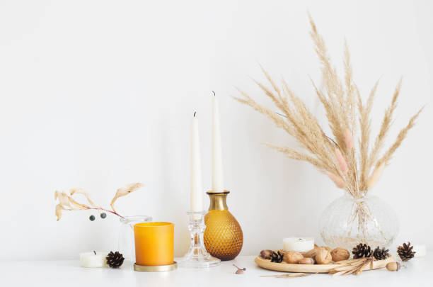 istock autumn home decorations with burning candles 1345336679