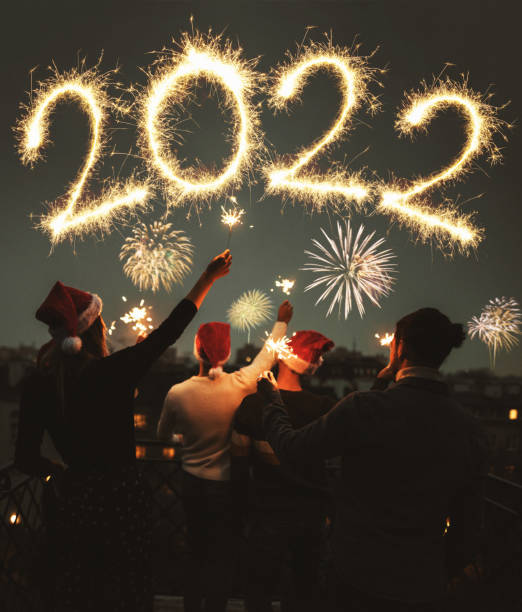istock friends celebrate the christmas on the rooftop 1345336896