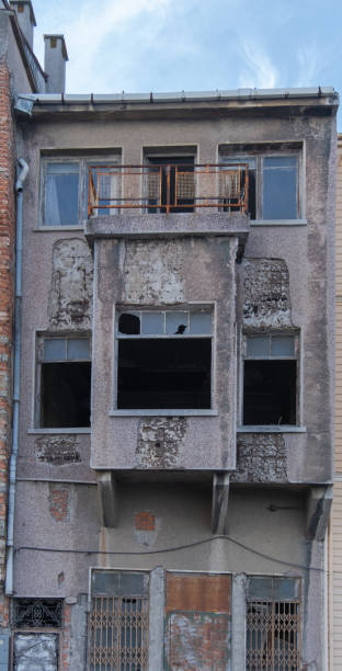 istock abandoned, ruined apartment. broken windows and plastered walls. 1345338543