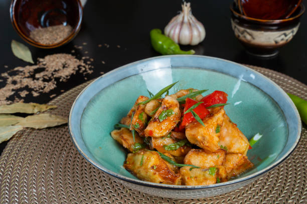 istock Salad with fried zucchini on a black background 1345339948