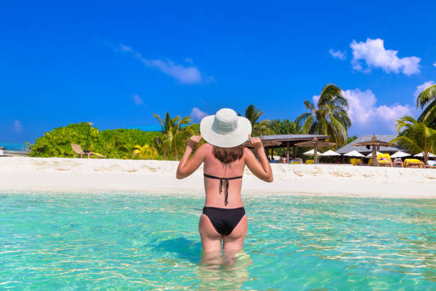 istock Woman at tropical beach 1345340440