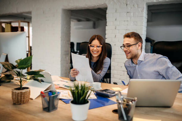 istock Two young businessman having a successful meeting in modern office. 1345341457