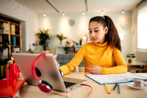 istock Girl is studying at home 1345343619