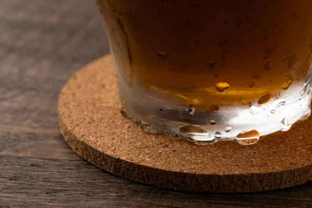 Cork coasters and glasses with water drops