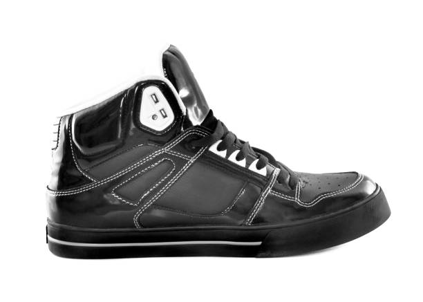 High-top black and white glossy sneaker High-top black and white glossy sneaker on white high tops stock pictures, royalty-free photos & images