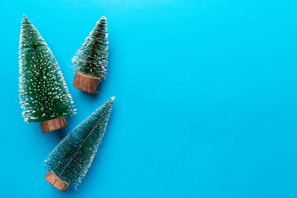 istock Flat lay composition with christmas trees on color background. Top view with copy space 1345346051