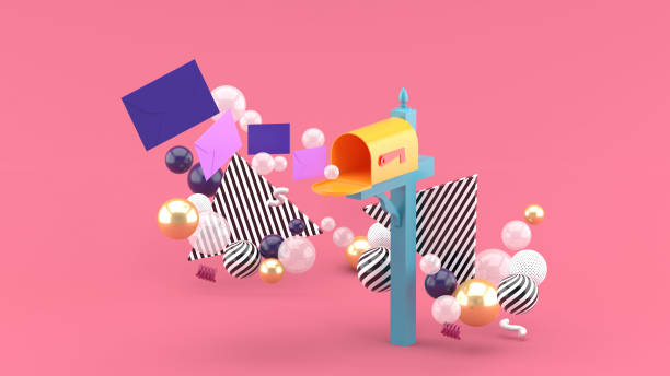 istock A floating letter from a mailbox surrounded by colorful balls on a pink background.-3d rendering. 1345346312