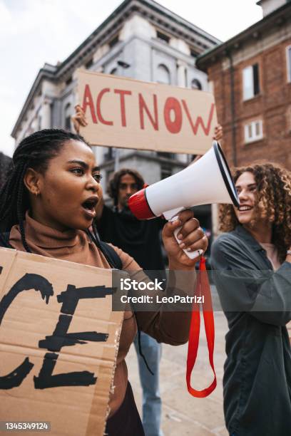 Antiracism Protest In The City Street A Group Of Students Marching Together Stock Photo - Download Image Now