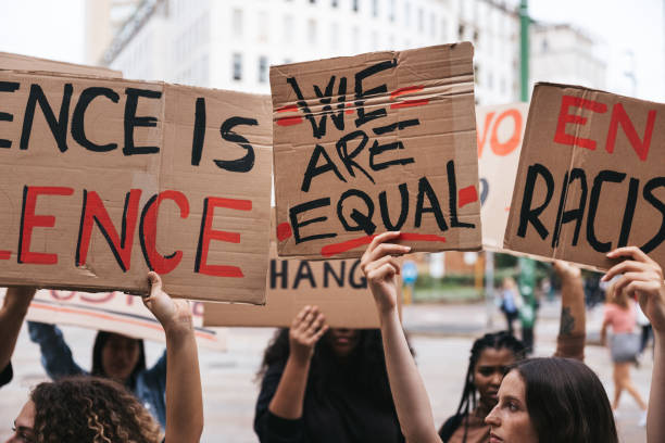 istock Close up on a group of activists holding their protesting messages 1345350317