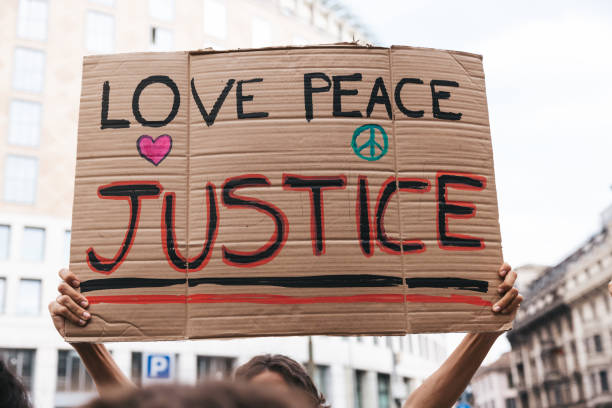 istock Close up on a group of activists holding their protesting messages 1345351497