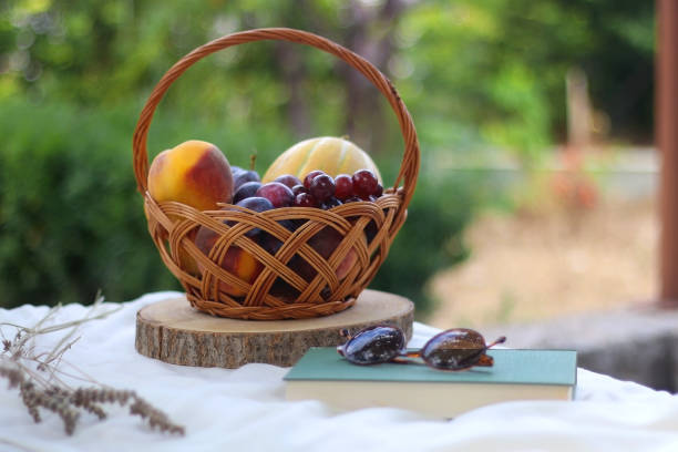 istock Fruit Basket, Book, Sunglasses and Lavender 1345354485