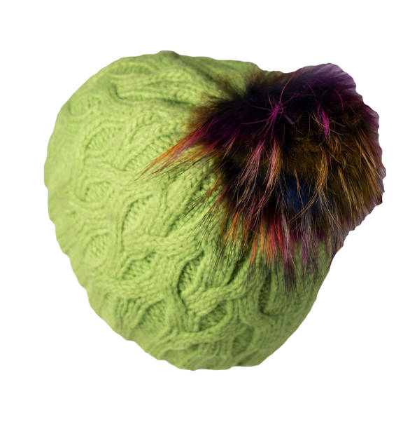 istock women's hat knitted with pompon isolated on white background. warm winter accessory 1345354659