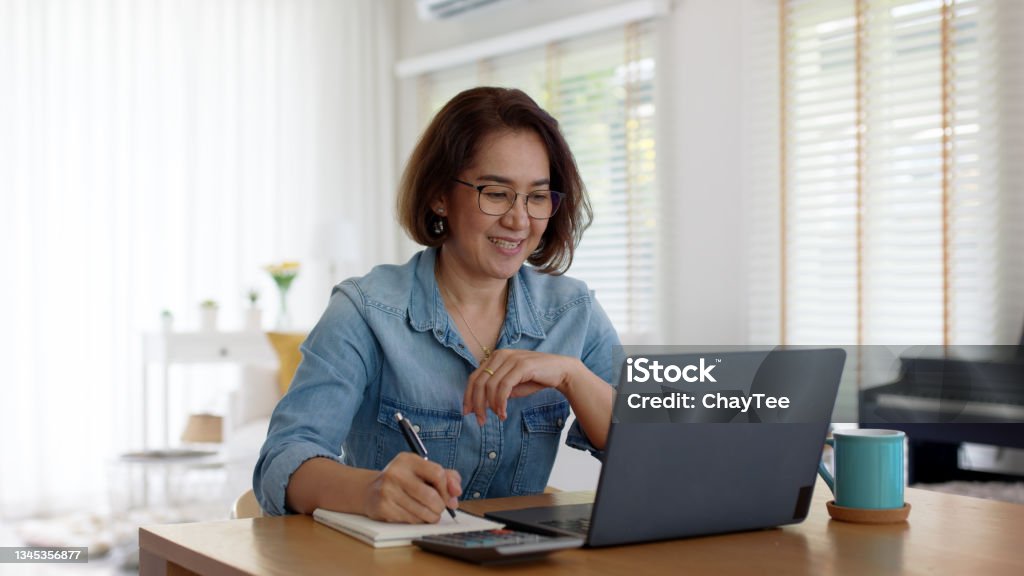 Asia adult happy people or sme owner latin lady sit consult talk in online seminar reskill upskill job discuss class for worker on desk table work at home in remote teach advice by digital training. Web Conference Stock Photo