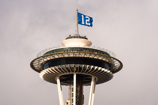 Seattle, Jan 4, 2020: The Seattle Space Needle flying the 12th fan Seahawks flag late in the day.