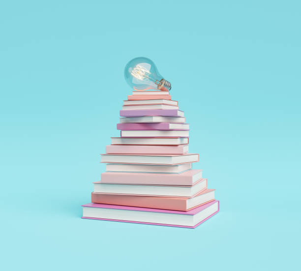 istock pyramid of books with lit light bulb 1345358325
