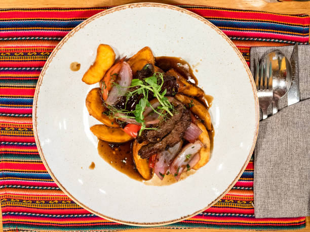 istock top view of Peruvian Lomo saltado in restaurant 1345359757