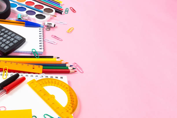 istock School and office supplies on a pink background 1345360087