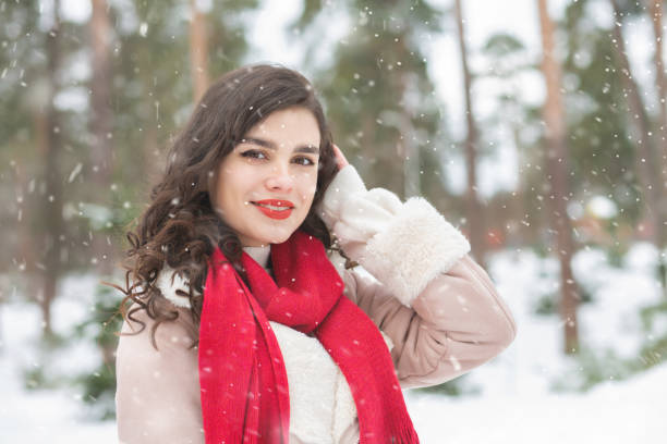 istock Adorable lady posing in snowy weather 1345360444