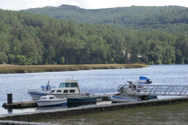 istock Small boats on the river Tambre 1345361572