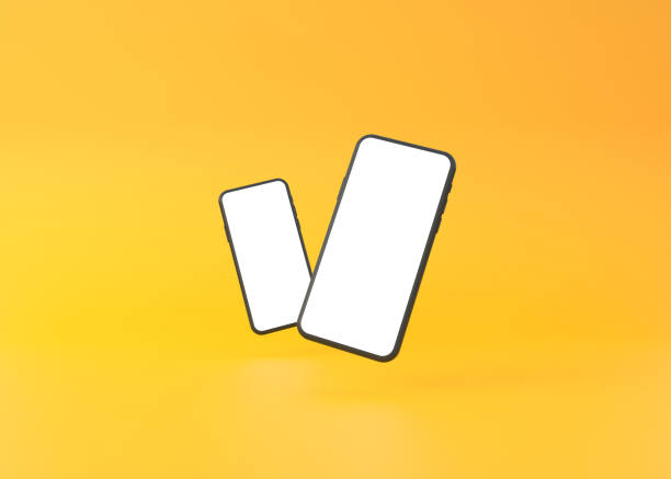 istock Two phones mockup are hovering on a yellow background 1345361764