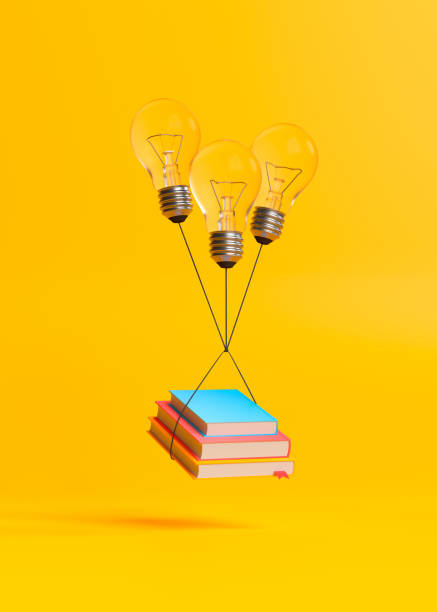 istock Books with bulb lamps flying on a yellow background 1345361784