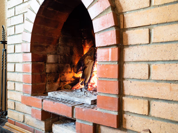 istock brick burning fireplace in country house 1345361922