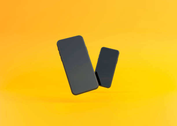 istock Two phones mockup are hovering on a yellow background 1345361945